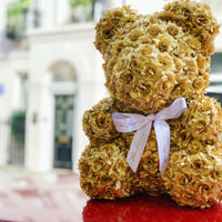 gold rose bear made of flowers
