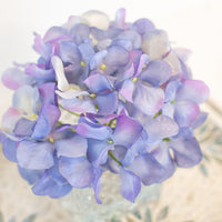 luxury home decor coffee table statement piece purple artificial flowers in vase