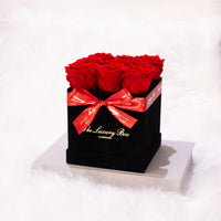 red infinity roses in black rose box