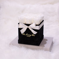 white infinity roses in black rose box