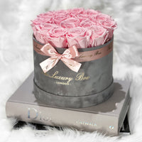 pink eternity roses in grey velvet box