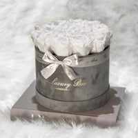 white eternity roses in grey velvet box