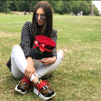 woman with red roses in a box for valentine's day