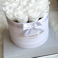 white eternity roses in white velvet box