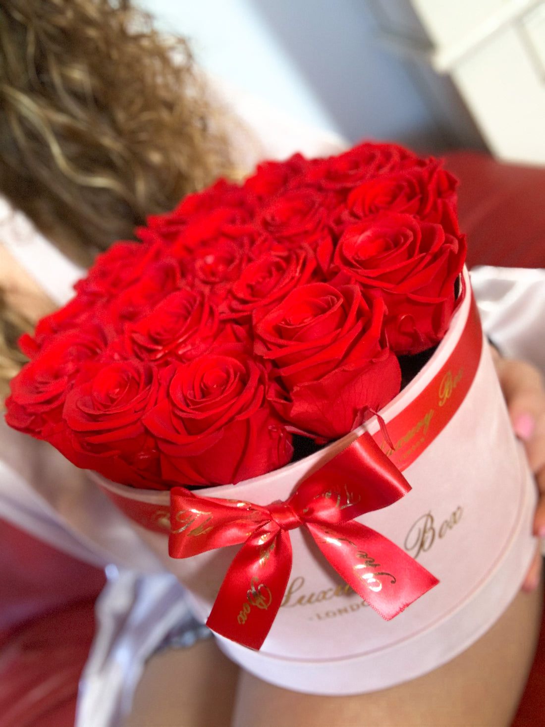 red eternity preserved roses in pink velvet box for her