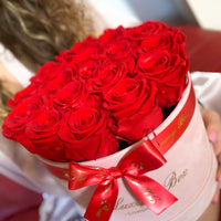 red eternity preserved roses in pink velvet box for her