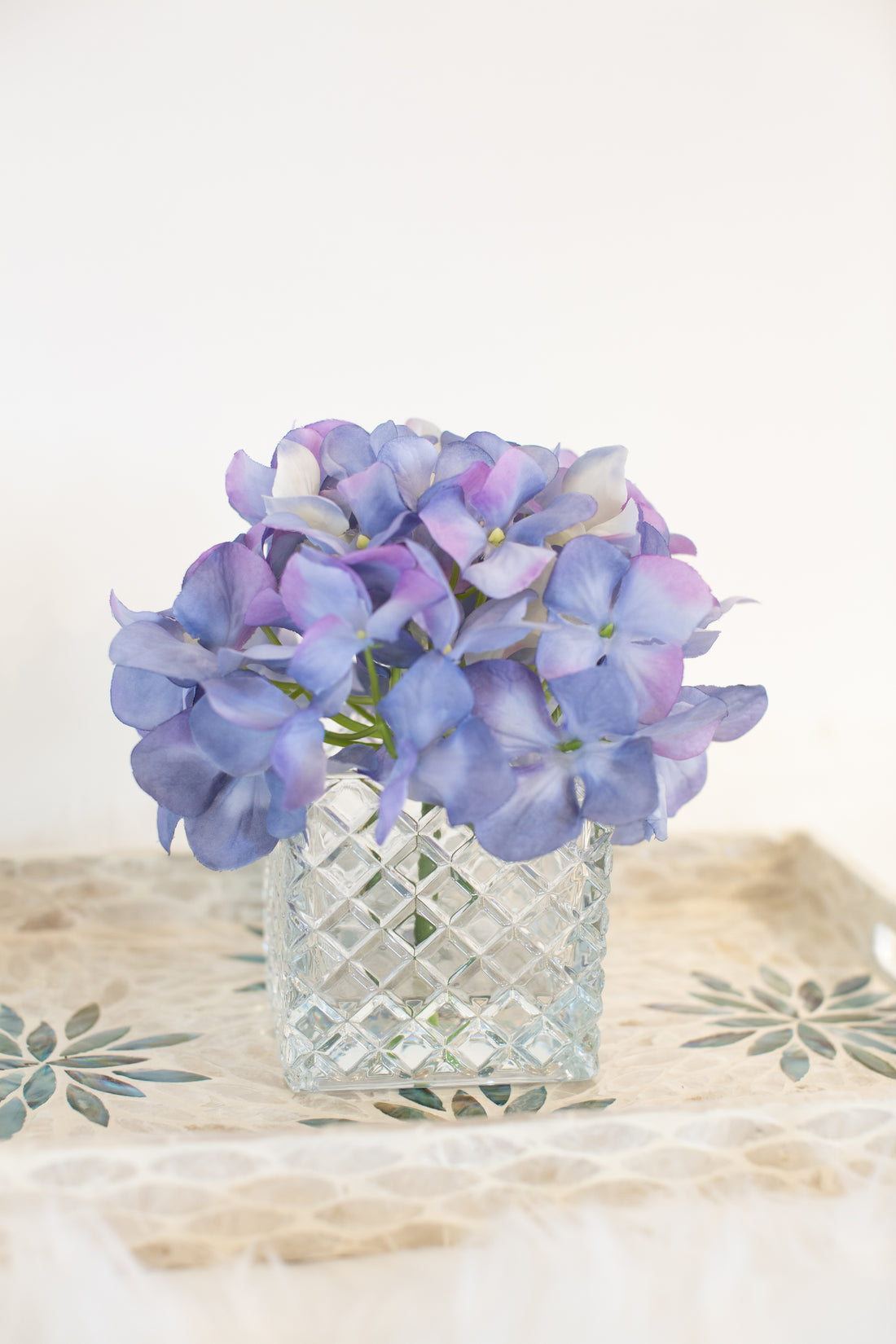 cute purple artificial flowers in vase for luxury home decor