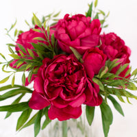 pink artificial flowers in vase for home decoration