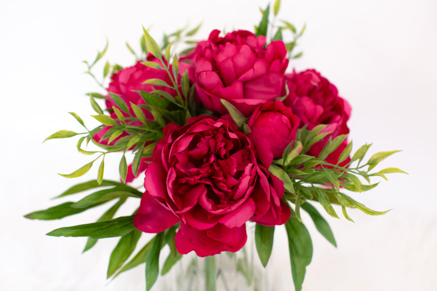 pink artificial flowers in vase for home decoration