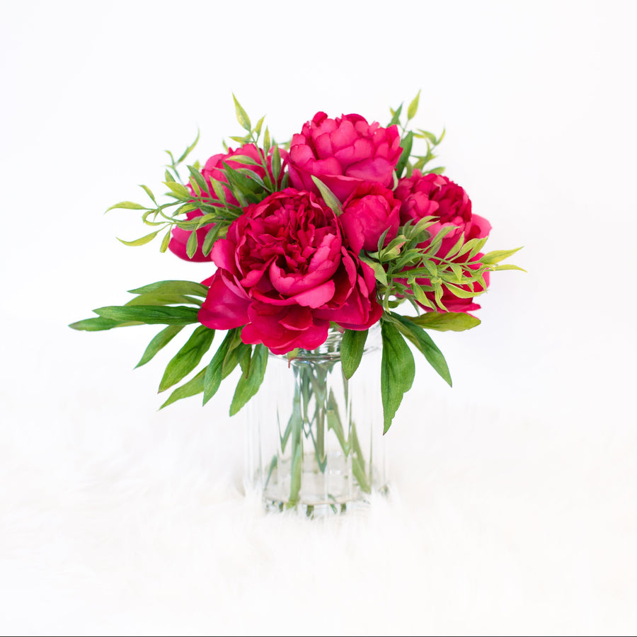 pink artificial flowers in vase for home decor