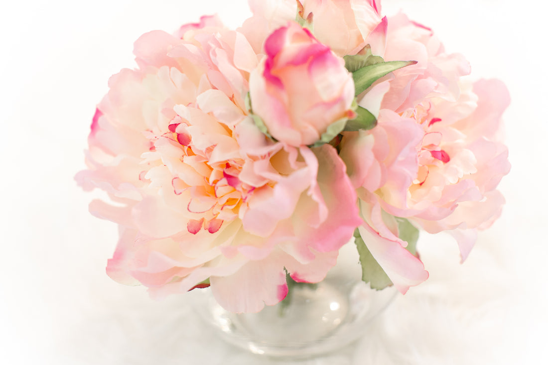 peach and pink artificial flowers in vase for coffee table luxurious home decor