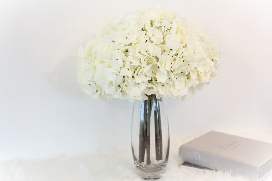 elegant artificial flowers in vase for luxury coffee table decoration