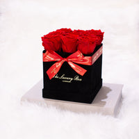 red infinity roses in black rose box