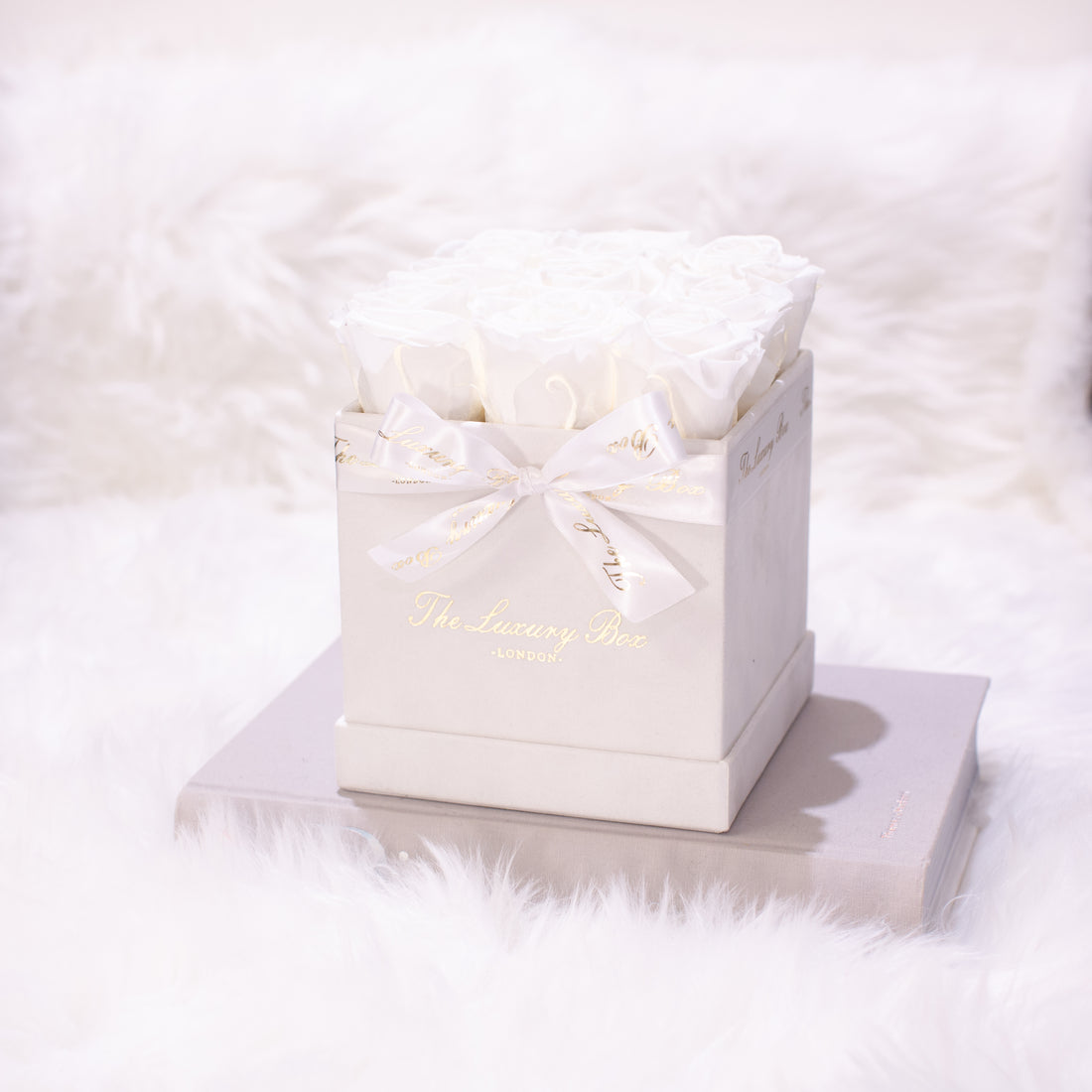 white infinity roses in white square rose box