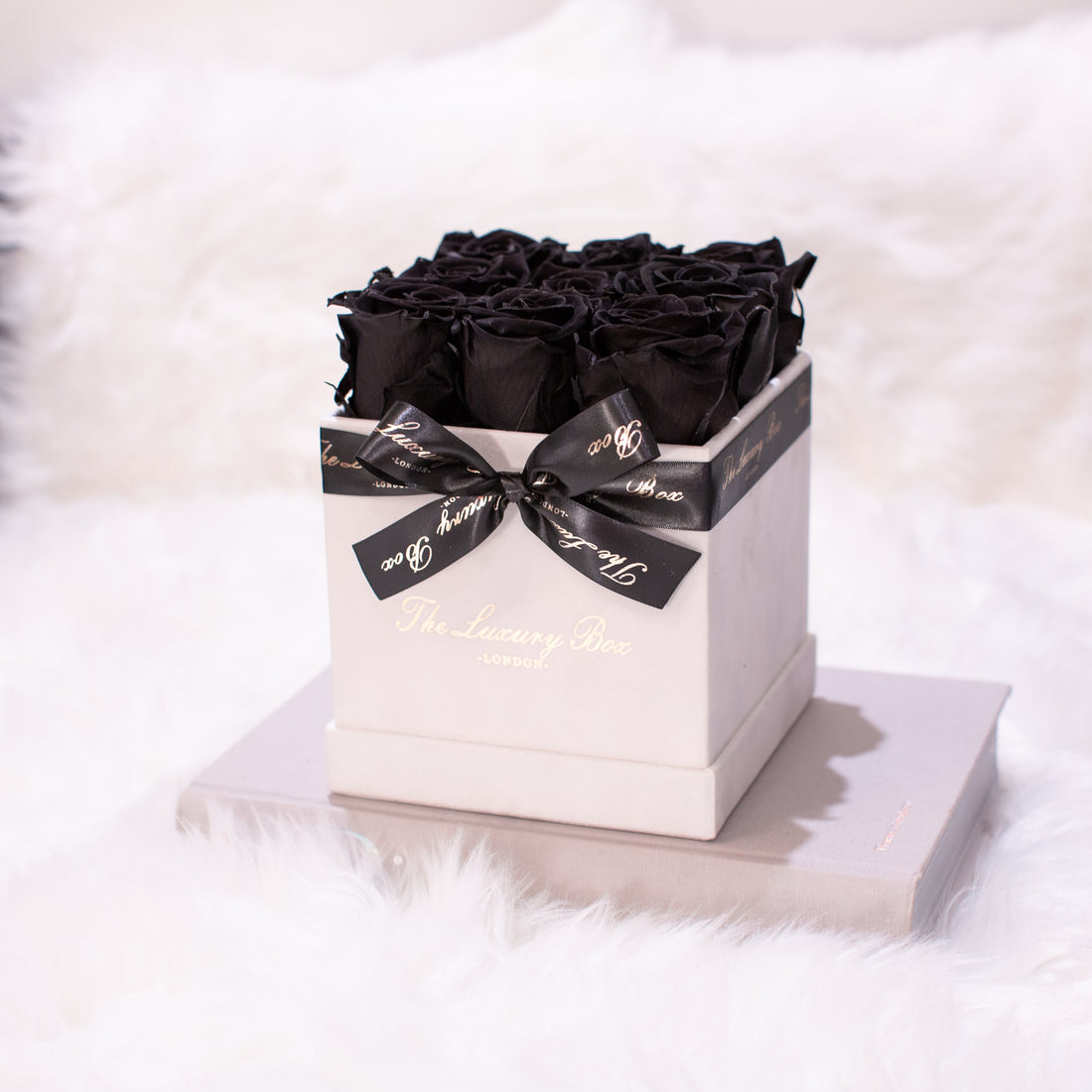 black infinity roses in white square rose box