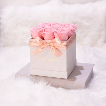 pink infinity roses in white square rose box