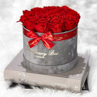 red eternity roses in grey velvet box
