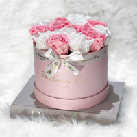 pink and white eternity roses in classic box