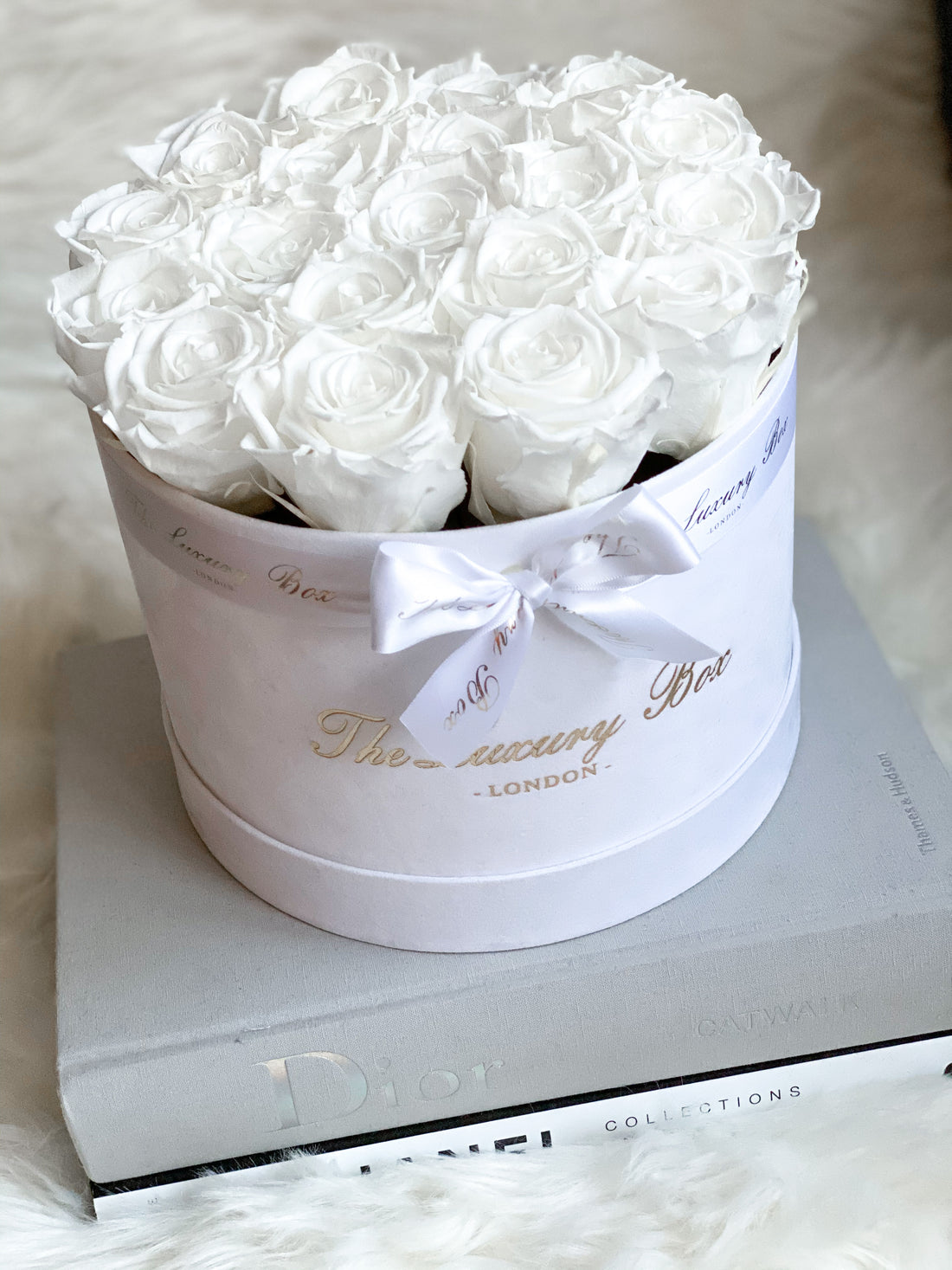 white eternity roses in white velvet box 